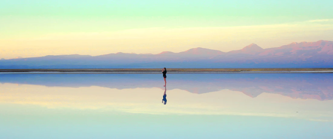 person standing near body of water during daytime
