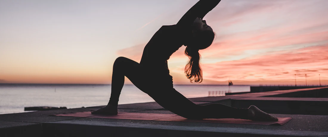 silhouette photography of woman doing yoga